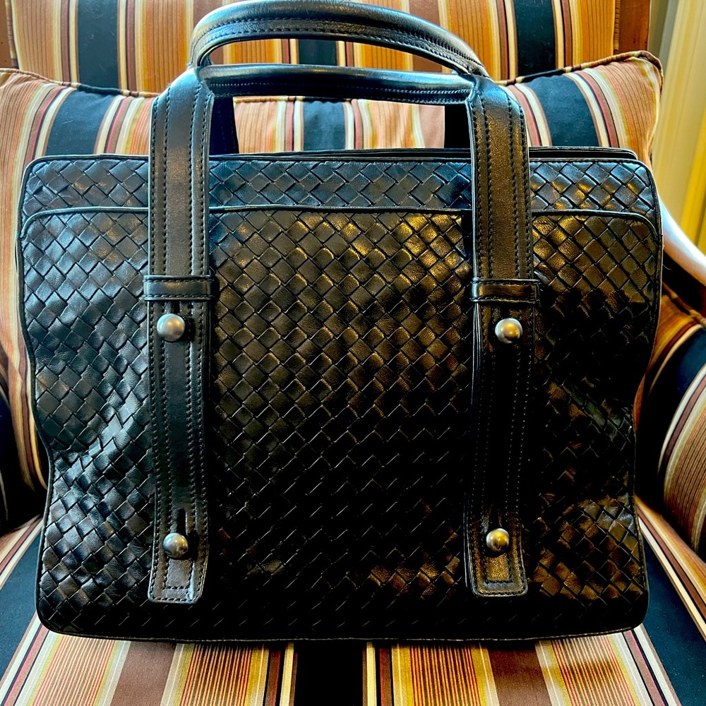 Bottega Veneta calfskin woven leather tote with gunmetal hardware accents.